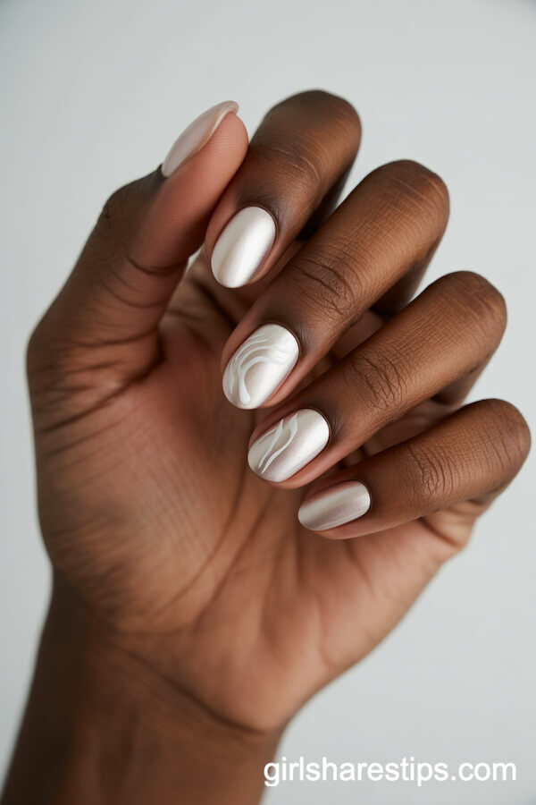 Pearl White Oval Nails with Subtle Swirl Designs