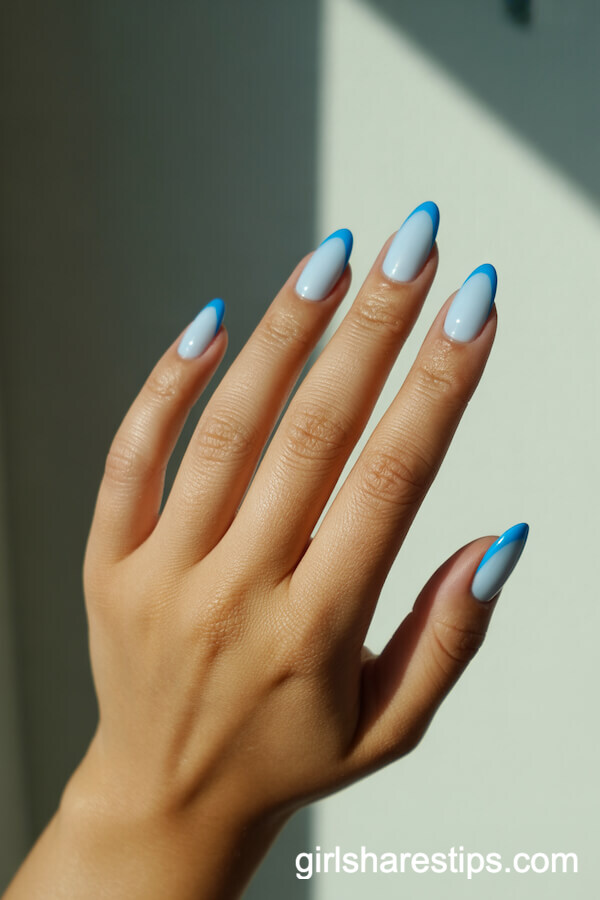 Matte Baby Blue Almond Nails with Glossy French Tips