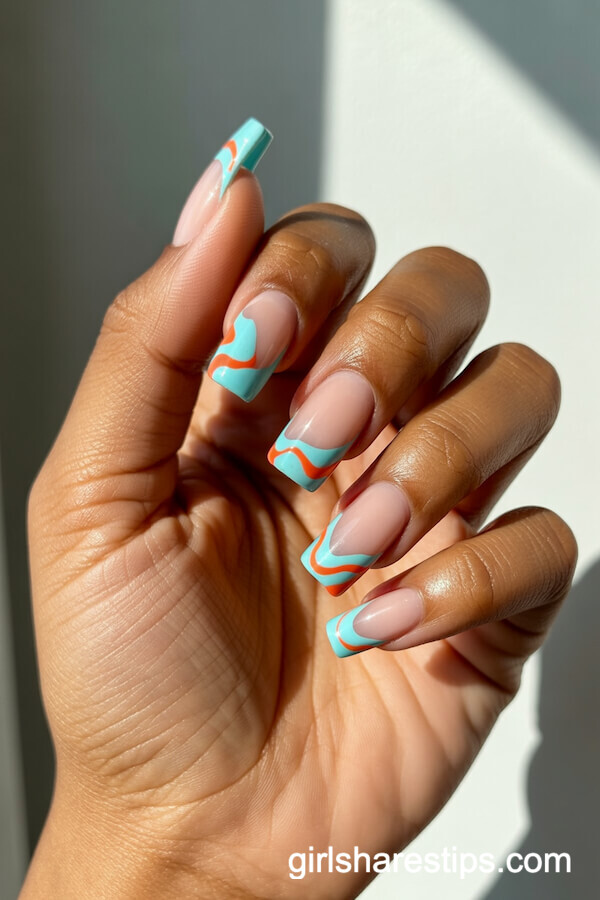 Bold Wavy French Tips in Turquoise and Coral on Coffin Nails