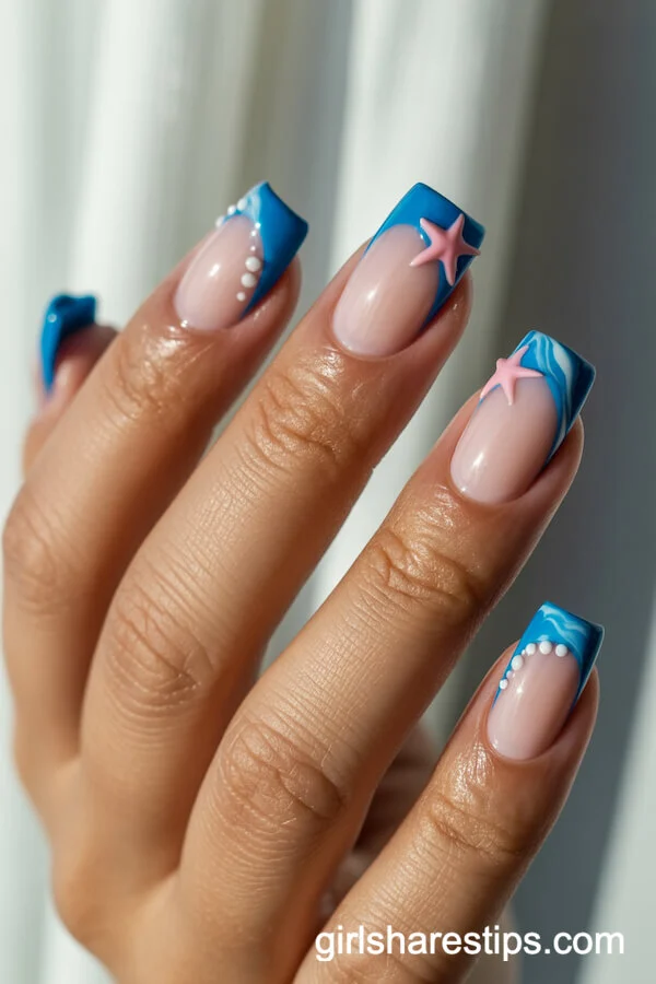 Ocean Blue Marbled French Tips with Starfish for a Beachy Vibe