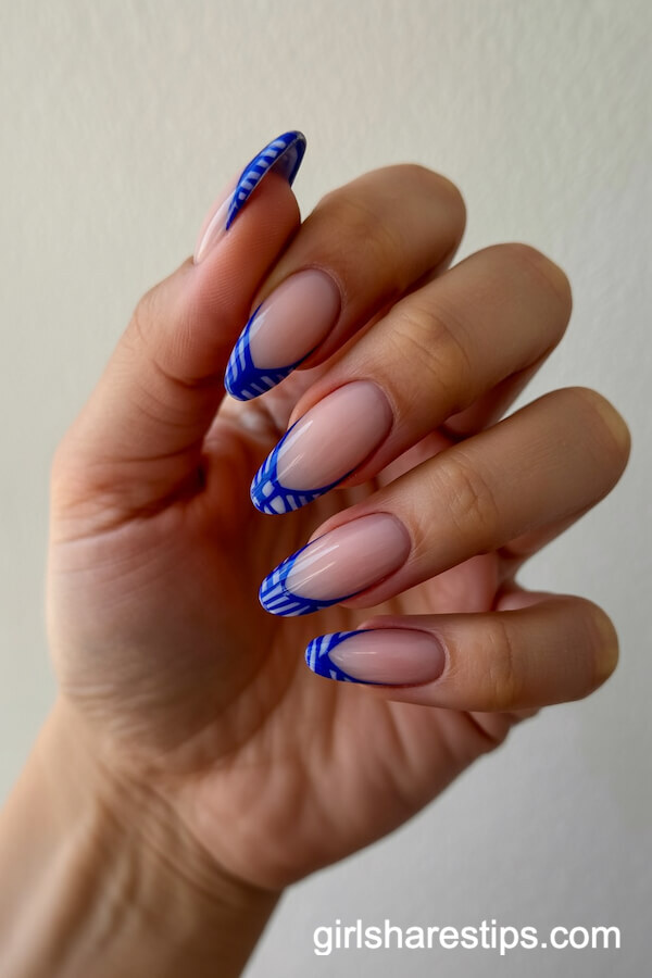 Cobalt Blue Graphic French Tips on Almond Nails