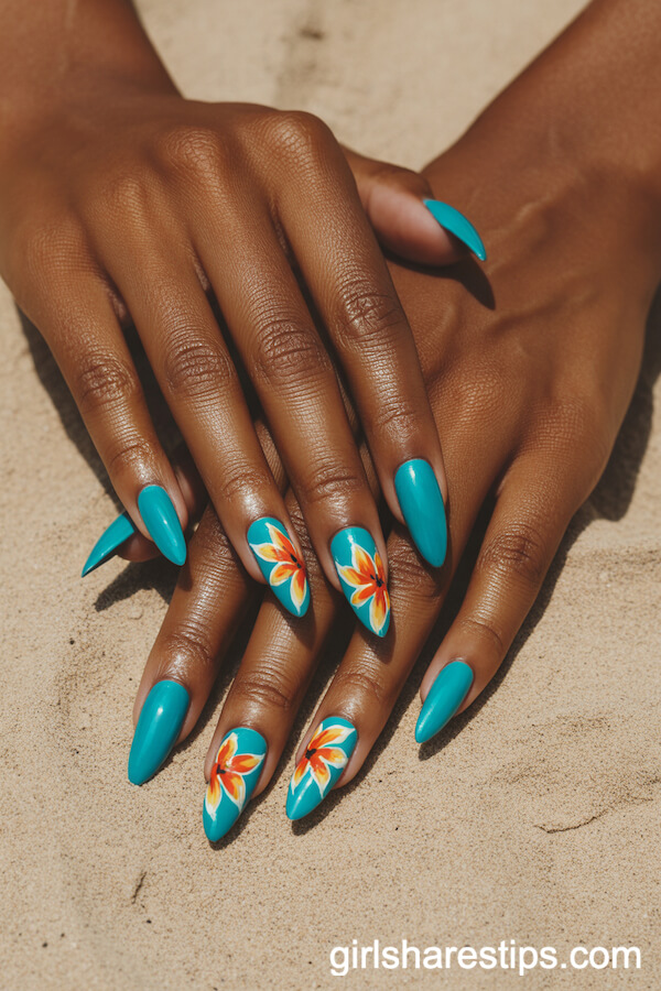Vibrant Turquoise Stiletto Nails with Hand-Painted Tropical Flowers