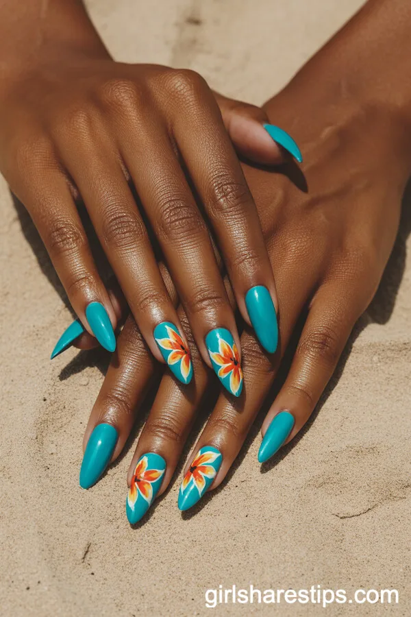 Vibrant Turquoise Stiletto Nails with Hand-Painted Tropical Flowers