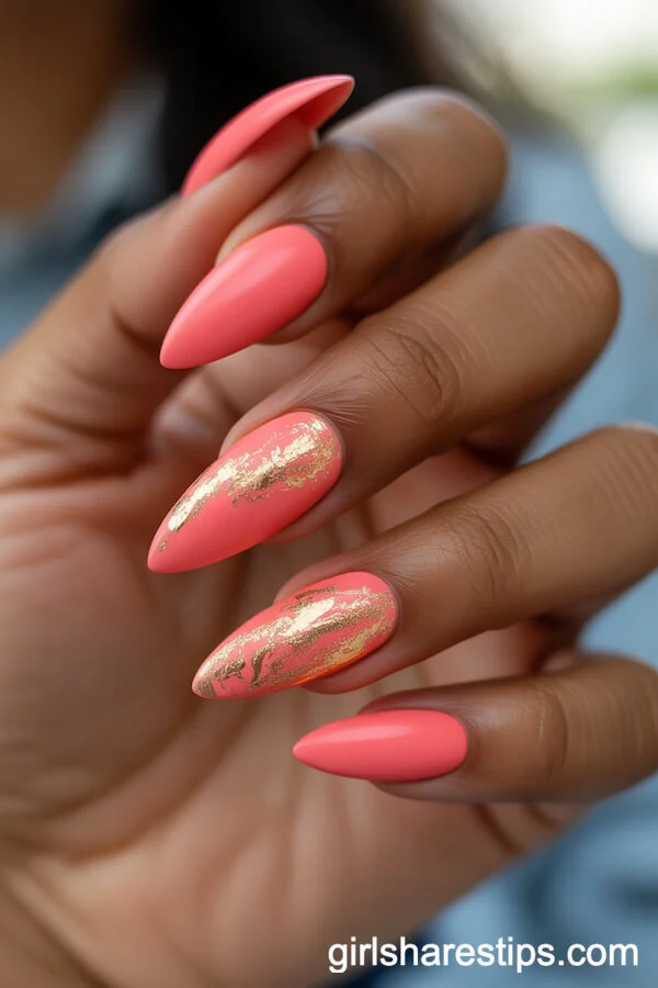 Vivid Coral Stiletto Nails with Gold Foil Accents