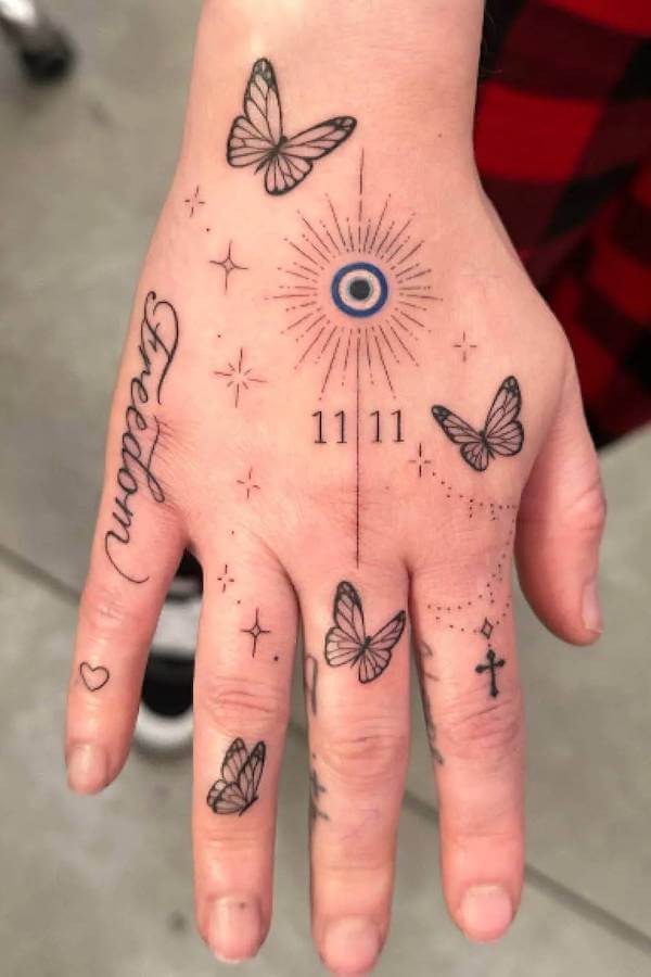 Butterfly and Symbol Hand Tattoo