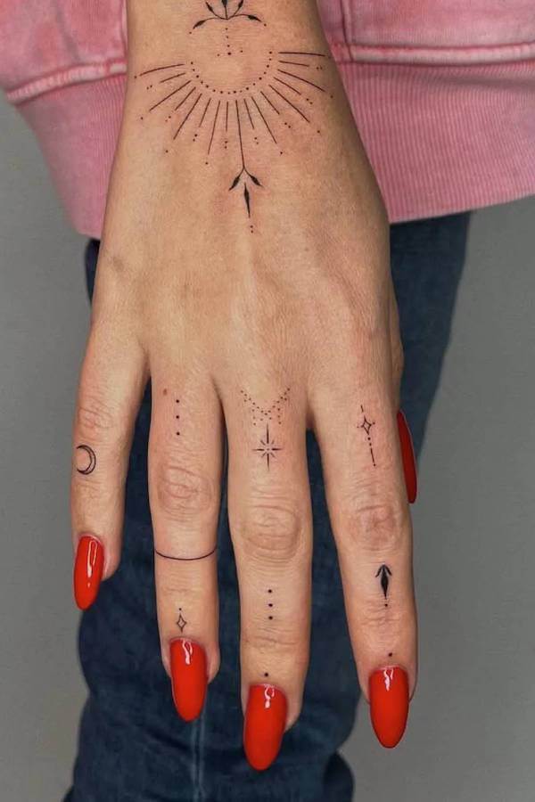 Minimalist Sun and Moon Hand Tattoo