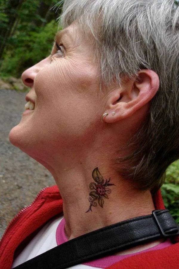Small Floral Neck Tattoo