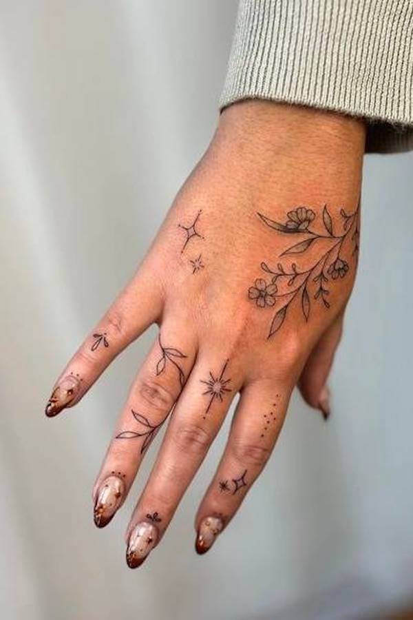 Botanical Hand and Finger Tattoo