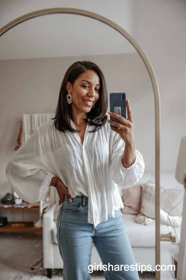 Flowy White Blouse with Blue Jeans and Statement Earrings