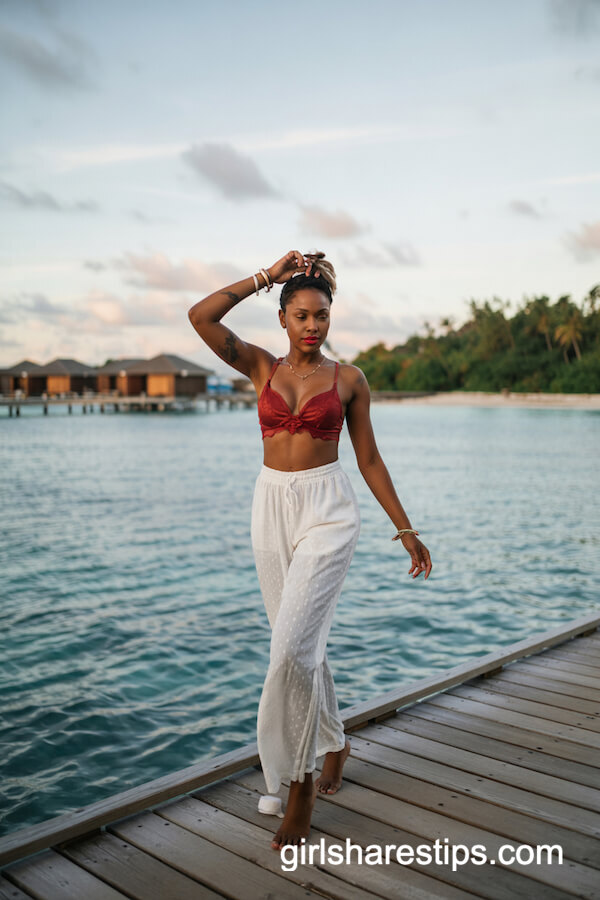 Red Lace Bralette and White Wide-Leg Pants by the Ocean