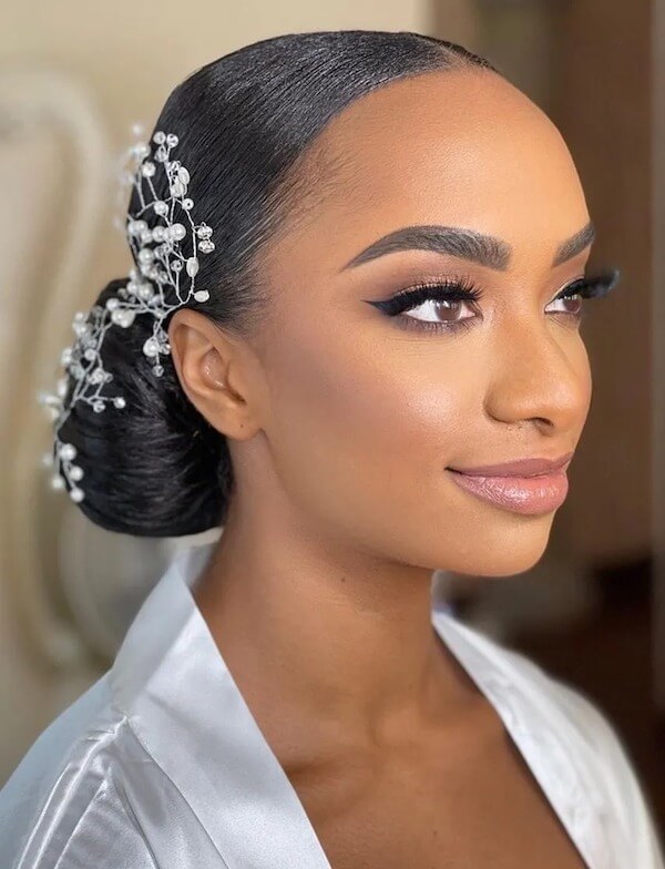 Elegant Low Bun with Pearl Hairpiece