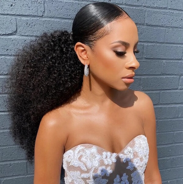 Sleek Low Puff with Defined Curls