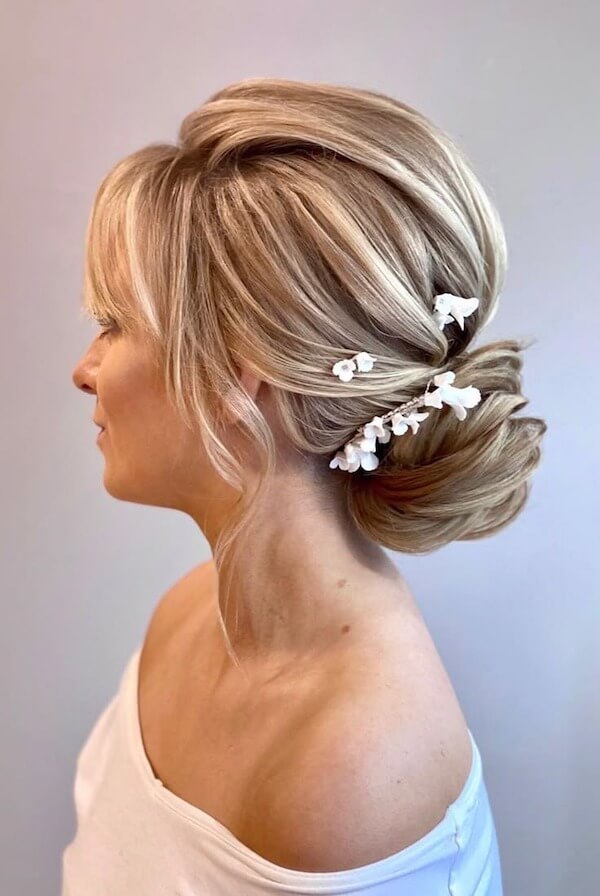 Chic French Twist with Floral Accent