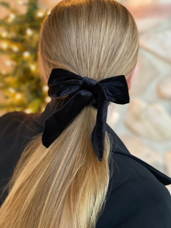 Sleek Low Ponytail with Black Velvet Bow