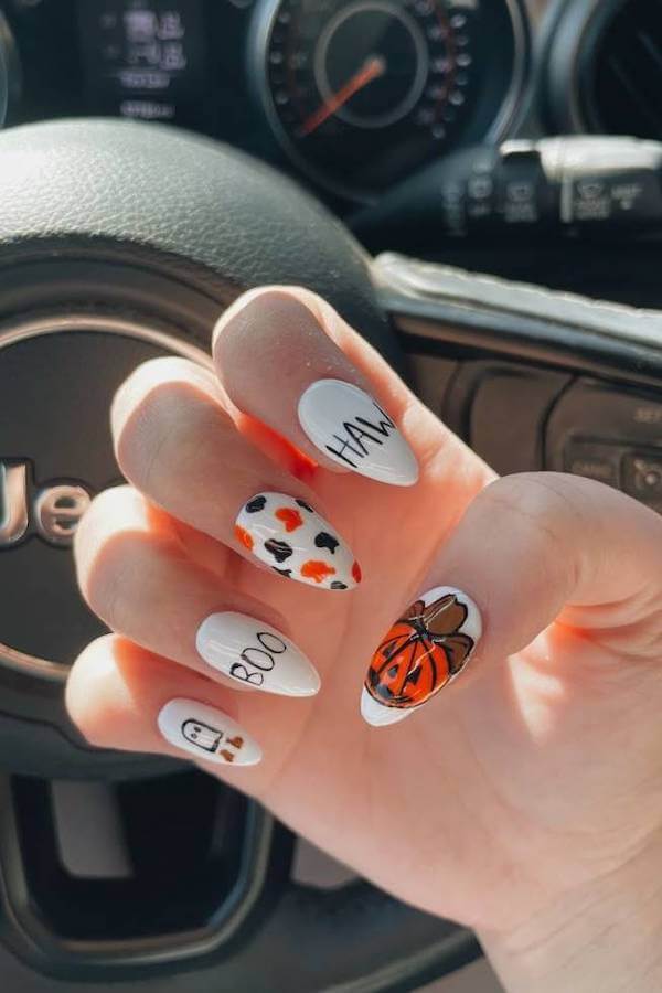 Pumpkin and Cow Print Halloween Nails