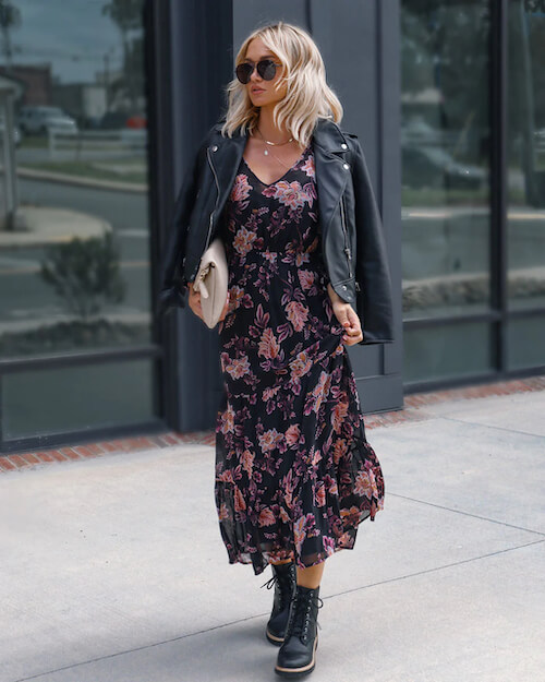 a black leather jacket and a long floral dress