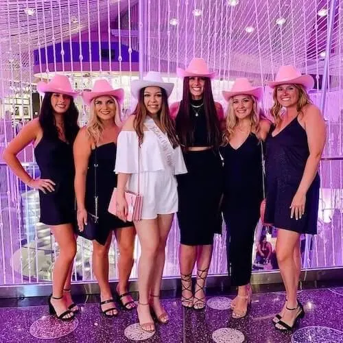 a group of women including the bride to be wearing bachelorette group outfits in Nashville