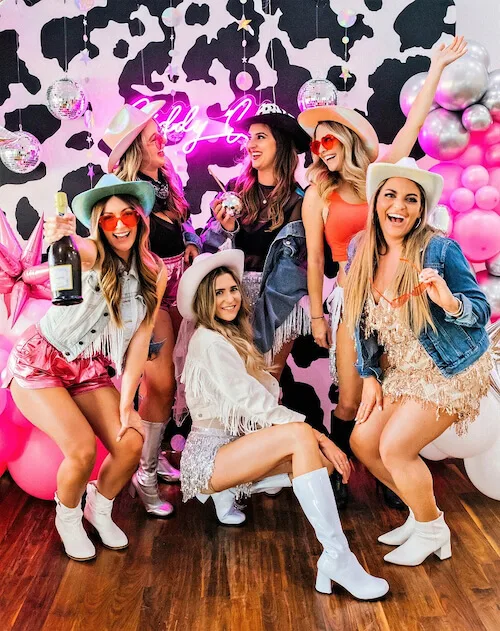 a group of women in a Nashville bachelorette party wearing stylish and fun bachelorette party outfits