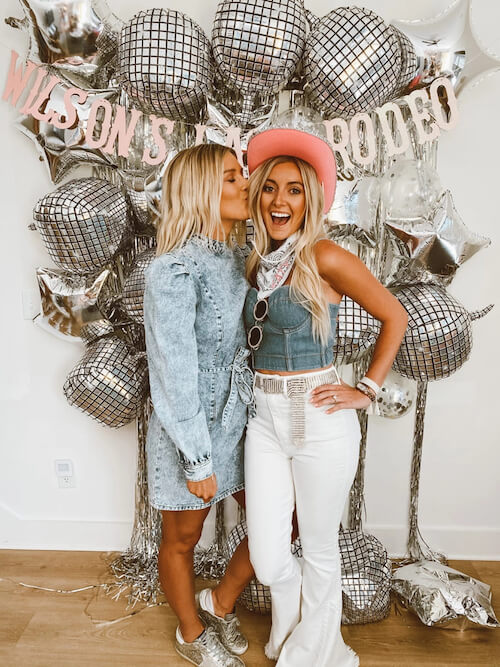 two women in a disco themed Nashville bachelorette party wearing denim pieces