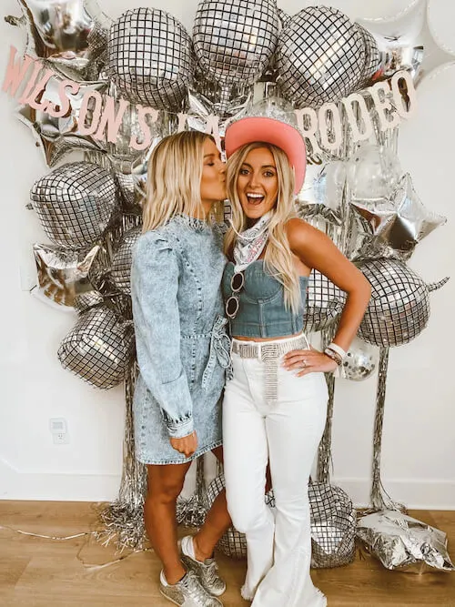 two women in a disco themed Nashville bachelorette party wearing denim pieces