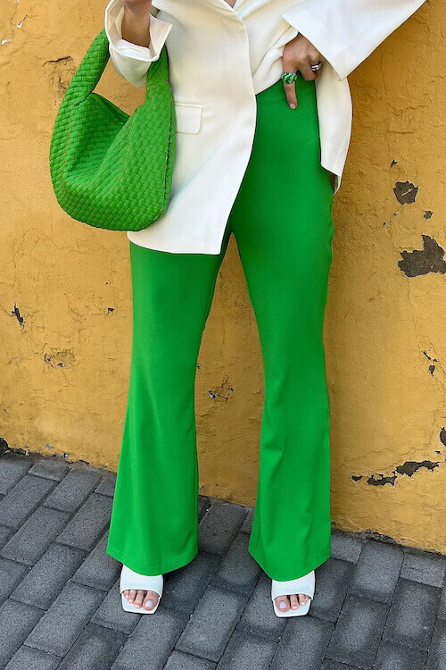 Young female with green pants and red shoes against concret Stock Photo   Alamy