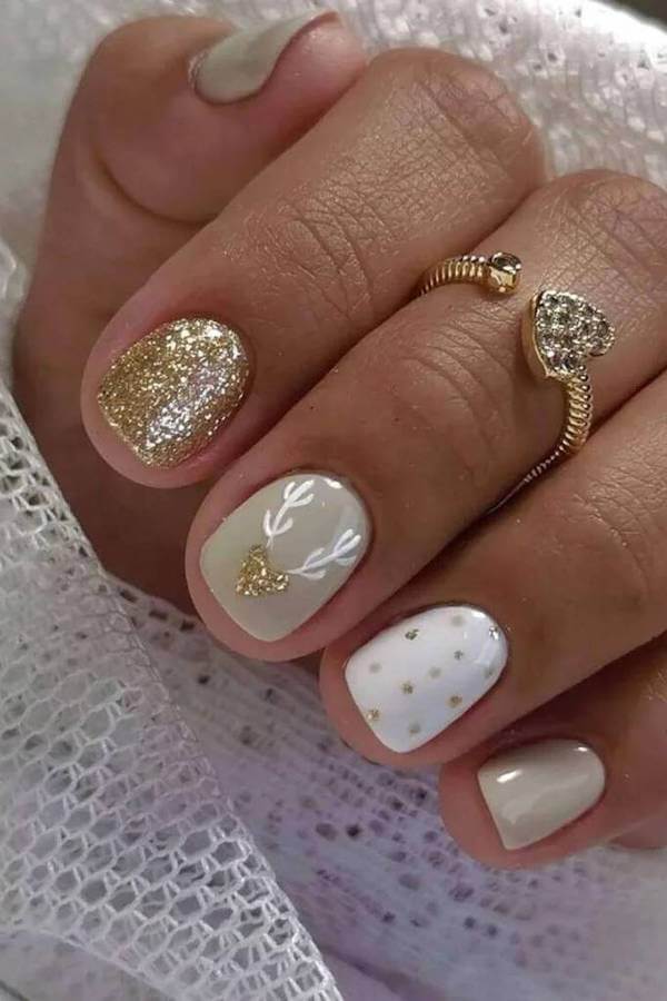 Gold and White Reindeer Nails