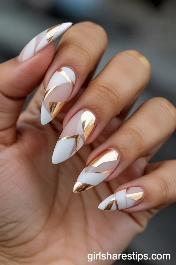 Matte Stiletto Nails with Abstract Gold Geometric Patterns