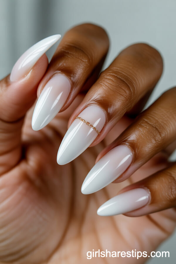 Milky White Almond Nails with Delicate Gold Chain Detail