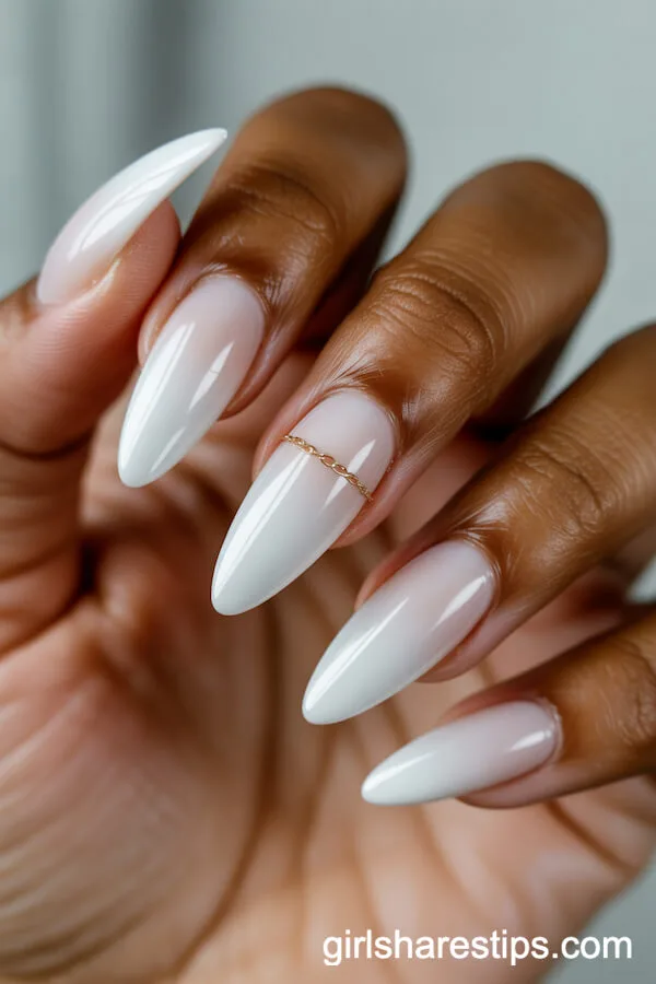Milky White Almond Nails with Delicate Gold Chain Detail