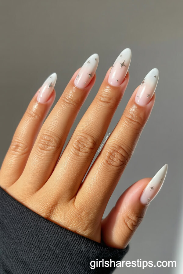 Chrome White Almond Nails with Metallic Star Accents