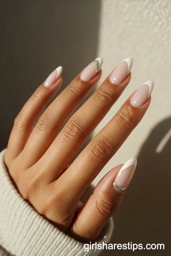 Minimalist Glossy White Almond Nails with Silver Ring Finger Detail