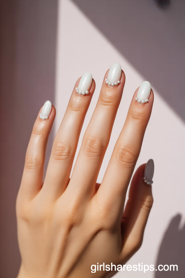 Short Oval White Nails with Tiny Pearl Embellishments