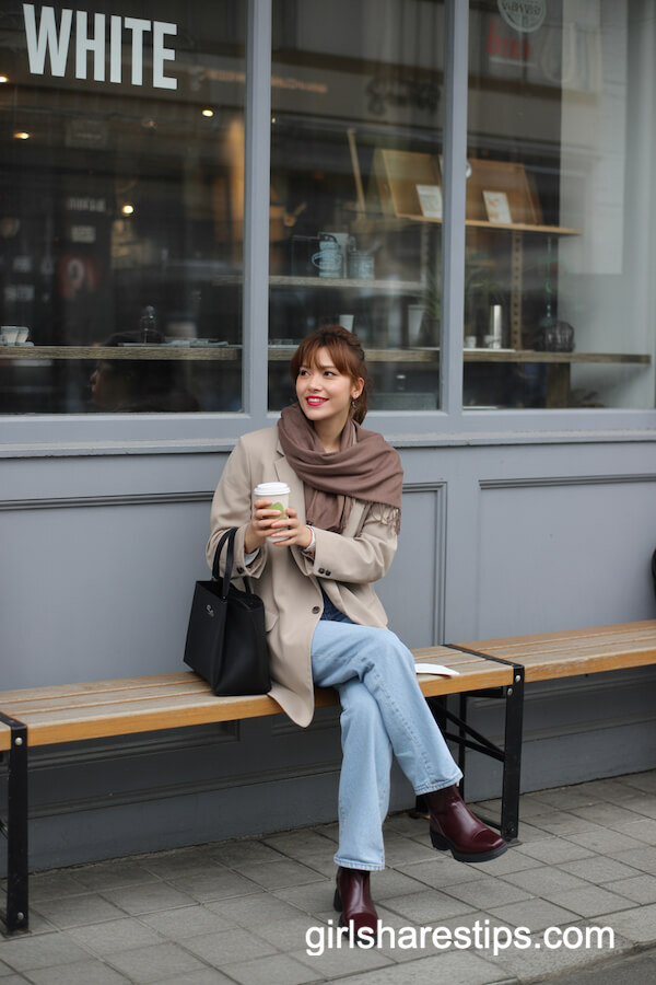 Beige Blazer, Jeans, and Burgundy Leather Boots