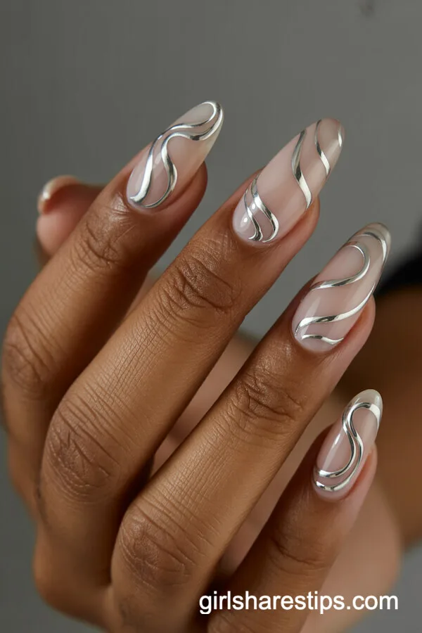 Neutral Chrome Almond Nails with Silver Swirl Details