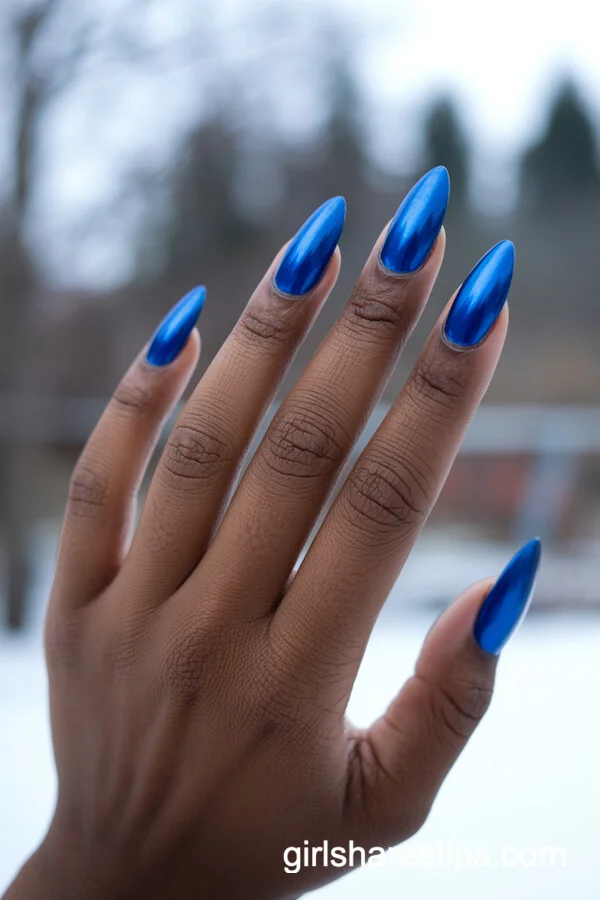 Electric Blue Chrome Stiletto Nails for Bold Winter Vibes