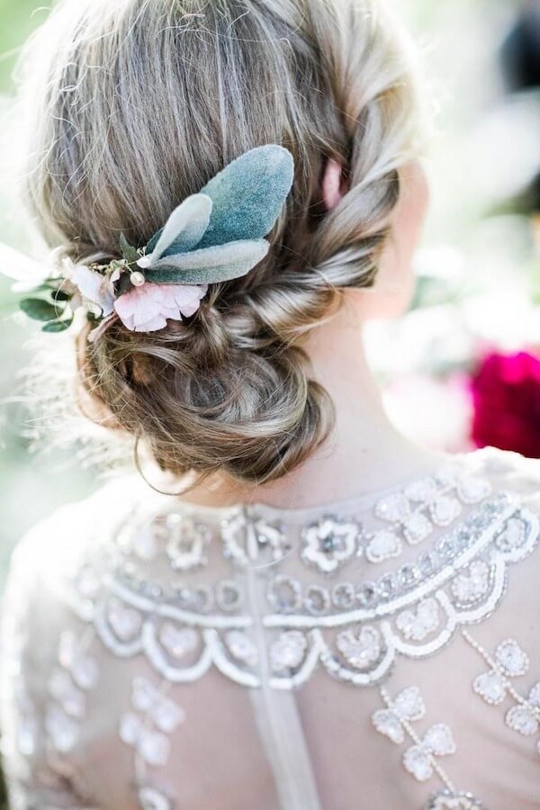 Romantic Low Twisted Bun with Floral Accents