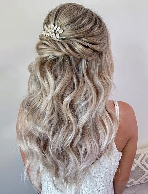 Wavy Half-Up Hairstyle with Floral Clip