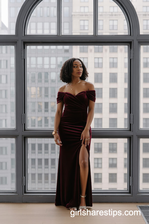 Burgundy Velvet Off-Shoulder Gown with Gold Jewelry