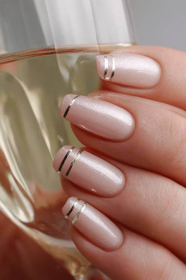 Shimmery French Tips with Gold Stripes
